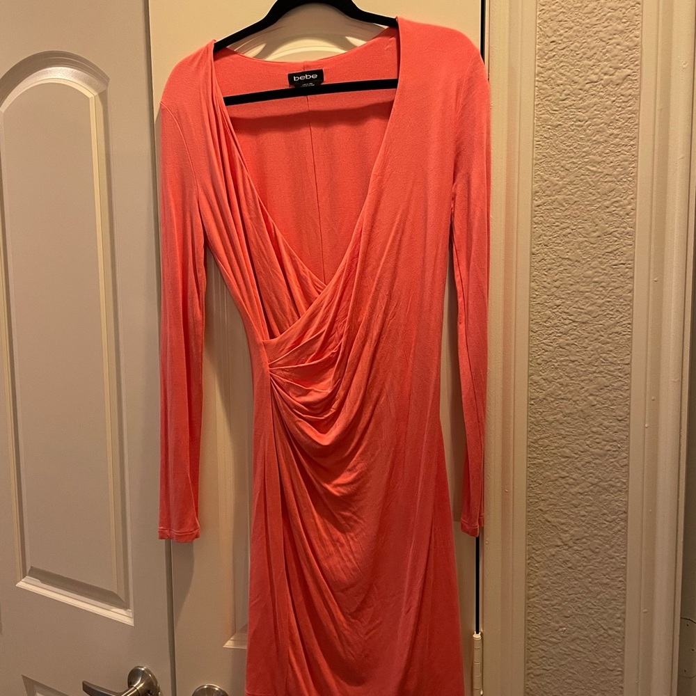Bebe peach orange medium size long sleeve dress. NWOT.